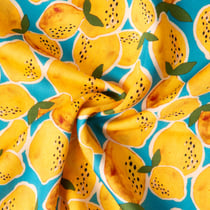 Tissu Viscose imprimé Limoncello pluie de citron sur fond Bleu turquoise
