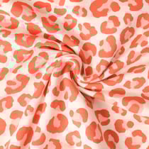 Tissu Sweat léger envers molletonné Naïa léopard Orange sur fond Beige