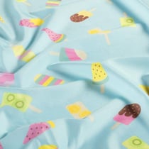 Tissu Lycra maillot de bain Fizzy sur fond Bleu pastel - Au mètre