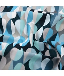 Tissu coton enduit Disco de 160 cm de largeur Bleu vendu par 50 cm