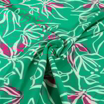 Tissu Stretch imprimé Motifs floraux blanc et rose sur fond Vert