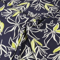 Tissu Stretch imprimé Motifs floraux blanc et vert sur fond Bleu marine