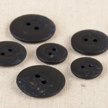 Bouton rond 2 trous copeaux 15mm noir