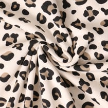 Tissu Sweat envers molletonné Savannah imprimé léopard sur fond Beige - Au mètre