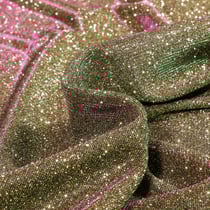 Tissu Jersey Lurex Pailleté sur fond Or reflets verts et mauves