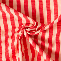 Tissu Coton Seersucker Rayé Pêche sur fond Rouge