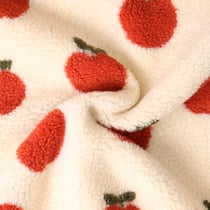 Tissu Fausse fourrure Mouton Romy pommes Rouges sur fond Ecru