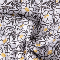 Tissu Coton Matelassé réversible Ray floral Noir et feuillage Jaune sur fond Blanc