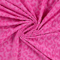 Tissu Maille motif léopard éponge sur fond Rose fuchsia