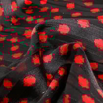 Tissu Mousseline Dots Lurex rouge sur fond Noir