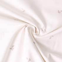 Tissu Popeline de Coton  feuilles Elia sur fond Ecru