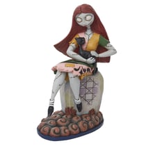 Figurine Enesco Disney Traditions - L'étrange Noël de M. Jack - Sally assise sur une tombe avec son chat