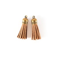 2 pompons de suédine - Or