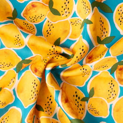 Tissu Viscose imprimé Limoncello pluie de citron sur fond Bleu turquoise