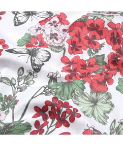 Tissu coton enduit géraniums de 160 cm de largeur Rouge vendu par 50 cm