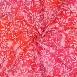 Tissu Batik de Coton rosaces Rose dragée sur fond Rouge