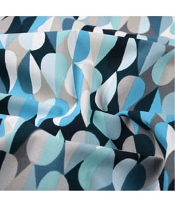 Tissu coton enduit Disco de 160 cm de largeur Bleu vendu par 50 cm