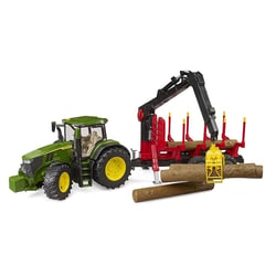 John Deere 7R avec remorque forestière et 4 troncs d'arbre