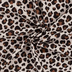 Tissu Jersey stretch Félina sur fond Beige clair - Au mètre