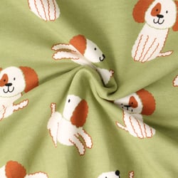 Tissu Sweat léger envers molletonné Oscar chiots Blancs sur fond Vert amande