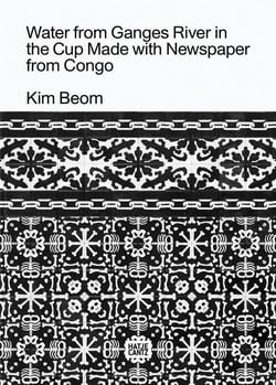 Kim beom water from ganges river in the cup made with newspaper from congo