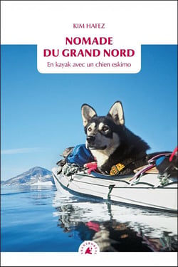 Nomade du grand nord - en kayak avec un chien eskimo