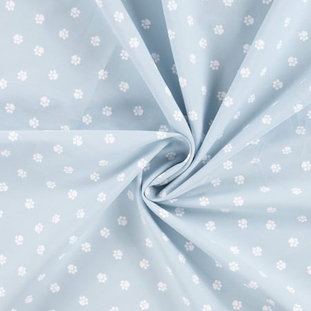 Tissu Popeline de Coton  patounes blanches Zumi sur fond Bleu ciel - Au mètre