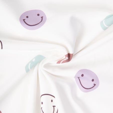 Tissu Sweat léger French Terry Smileys sur fond Blanc cassé
