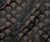 Tissu Jacquard d'habillement Éventails gaufrés bronze sur fond Noir
