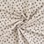Tissu Jersey Bord côte Léonie mini léopard Noirs et Camel sur fond Ecru