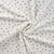 Tissu Jersey Velours tout doux Pattes de chien taupes et grises sur fond Blanc cassé