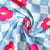 Tissu Sweat léger envers molletonné Jade fleurs Rose fuschia sur fond Blanc