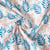 Tissu Coton imprimé rameaux Bleu et fleurs Corail sur fond Blanc cassé