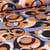 Tissu Viscose Twill extensible  Cercles abstraits orange sur fond Noir
