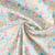 Tissu Popeline de Coton légère fleurs pastel miel, bleu azur et vert prairie sur fond Blanc