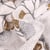 Tissu Jacquard Ginkgo graphique lurex sur fond écru