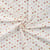 Tissus Jersey Coton imprimé Coeurs pailletés or sur fond Blanc cassé