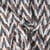 Tissu Maille chevrons duveteux Camel sur fond Noir