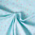 Tissu Popeline de Coton légère Petites fleurs jaune pastel et rose framboise sur fond Bleu lagon