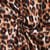 Tissu Viscose Lurex Féline taches fauves et noirs sur fond Blanc