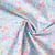 Tissu Popeline de Coton légère Petites fleurs et feuilles aquarelle pastel sur fond Bleu clair