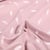 Tissu Coton imprimé Petites plumes sur fond Rose pâle
