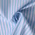 Tissu Coton imprimé  rayé Lisalou sur fond Bleu layette - Au mètre