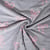 Tissu Jersey Mélangé Poppy Noeuds pailletés roses sur fond Gris chiné