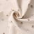 Tissu Double Gaze  fleurs Elior sur fond Beige clair