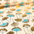 Tissu Toile Coton Feuilles Gingko dorés et bleues sur fond Naturel