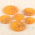 Bouton rond 2 trous copeaux 15mm jaune moutarde