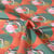 Tissu Coton imprimé Fleurs en panier vert sur fond Corail