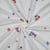 Tissu Double gaze de Coton Zohra petites fleurs brodées Bleu et Rose sur fond Blanc