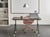 Bureau Pliant Marron Foncé et Noir Structure en Métal Rectangulaire à Roulettes Mobile 120 x 60 cm Style Moderne